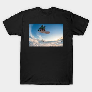 Snowboarder jumping against blue sky T-Shirt